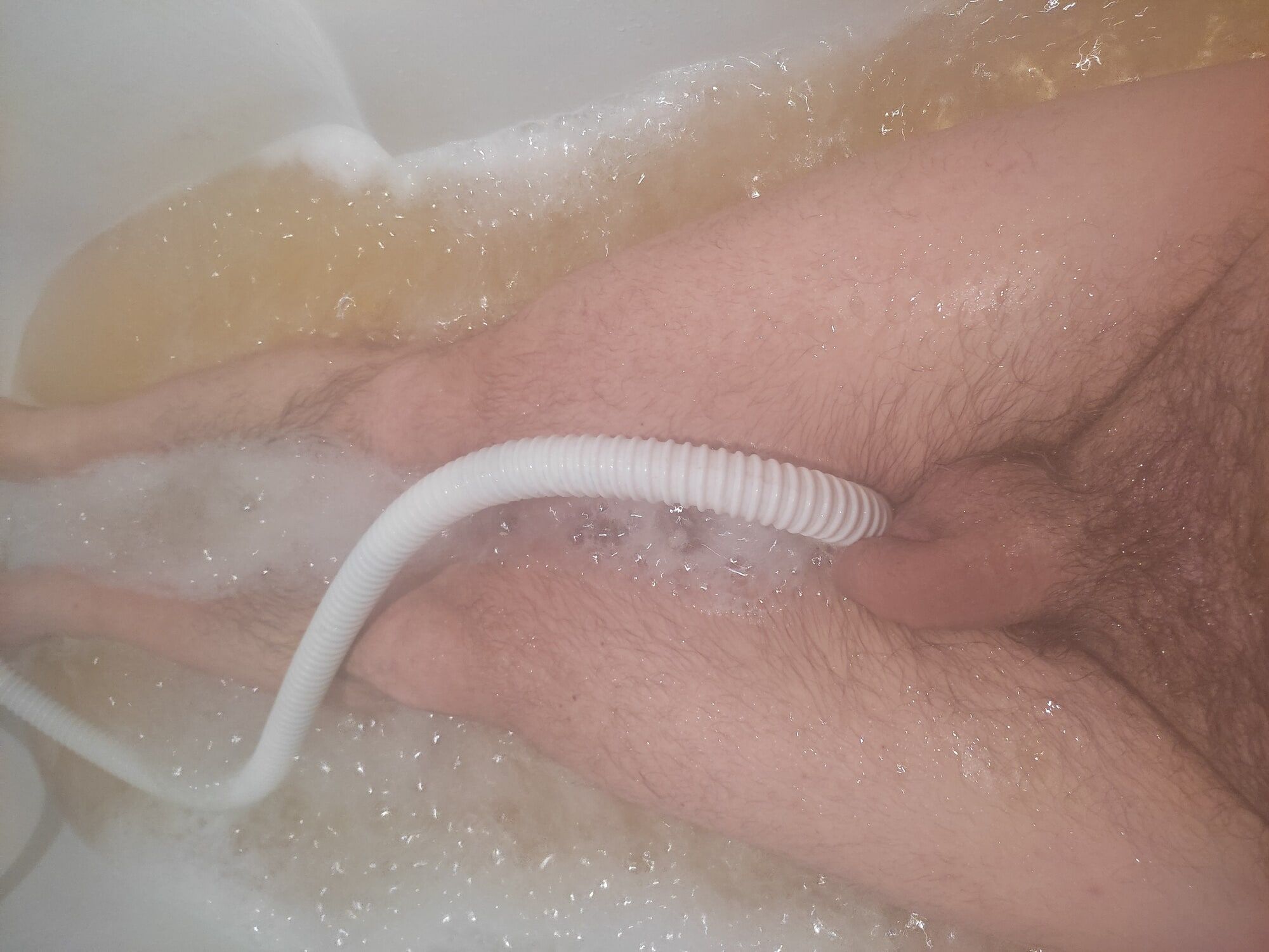 Male ass and cock in a bubblebath