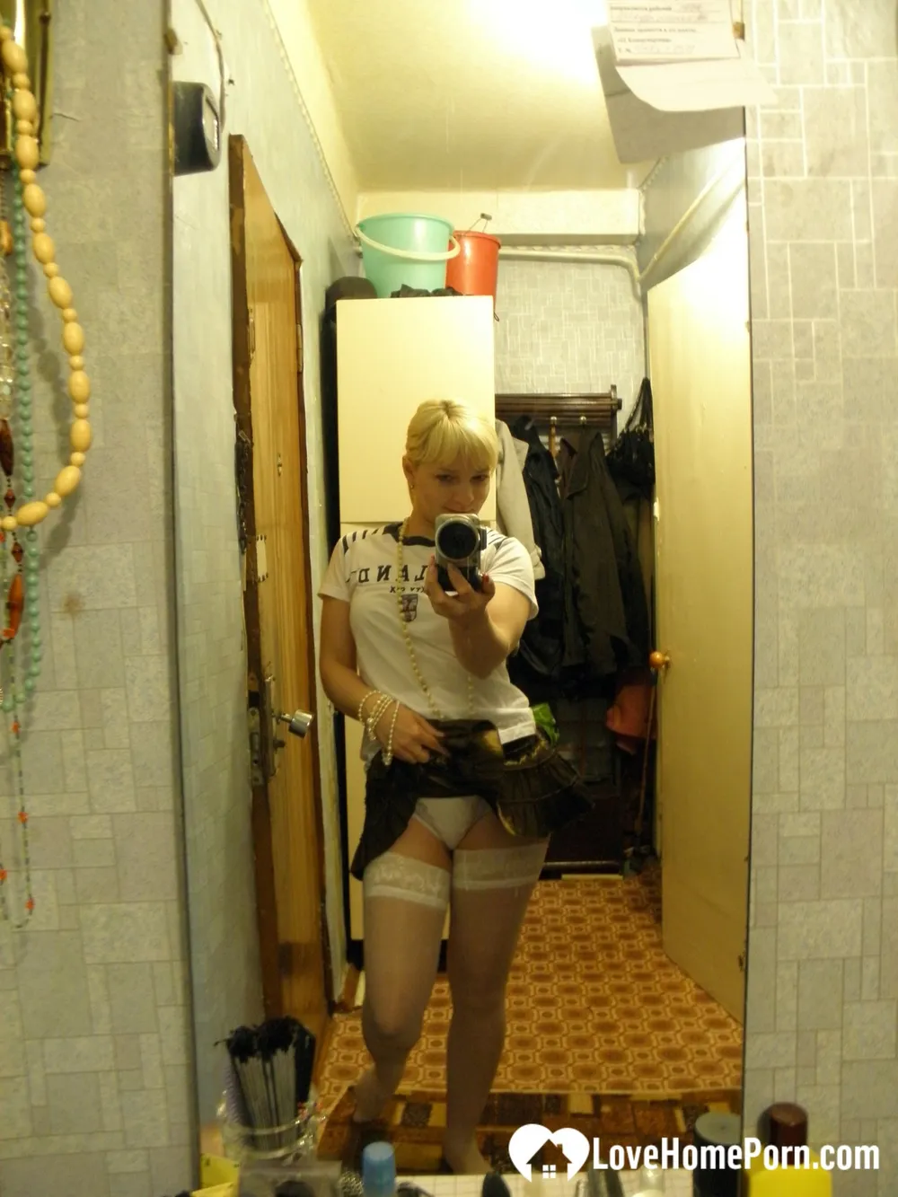 Aroused blonde in stockings taking naughty selfies #8