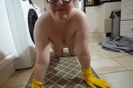 naked cleaning in rubber gloves         