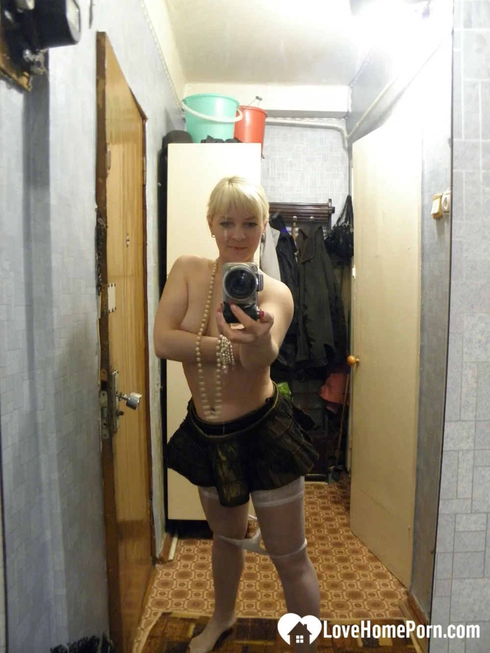 Aroused blonde in stockings taking naughty selfies #20