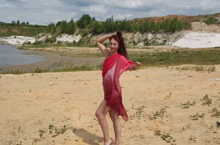 red shawl on white sand         