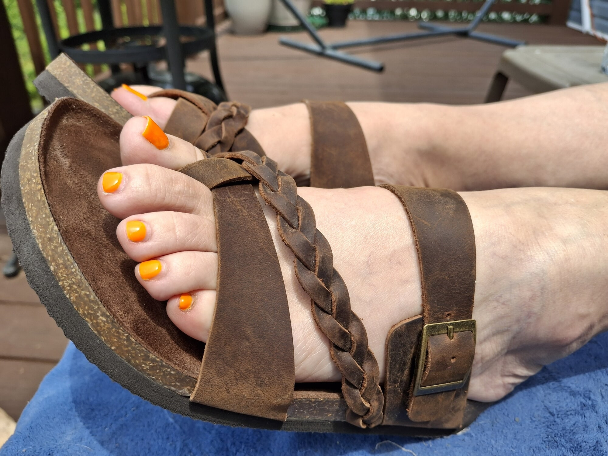 Cute feet in cute bare leather sandals