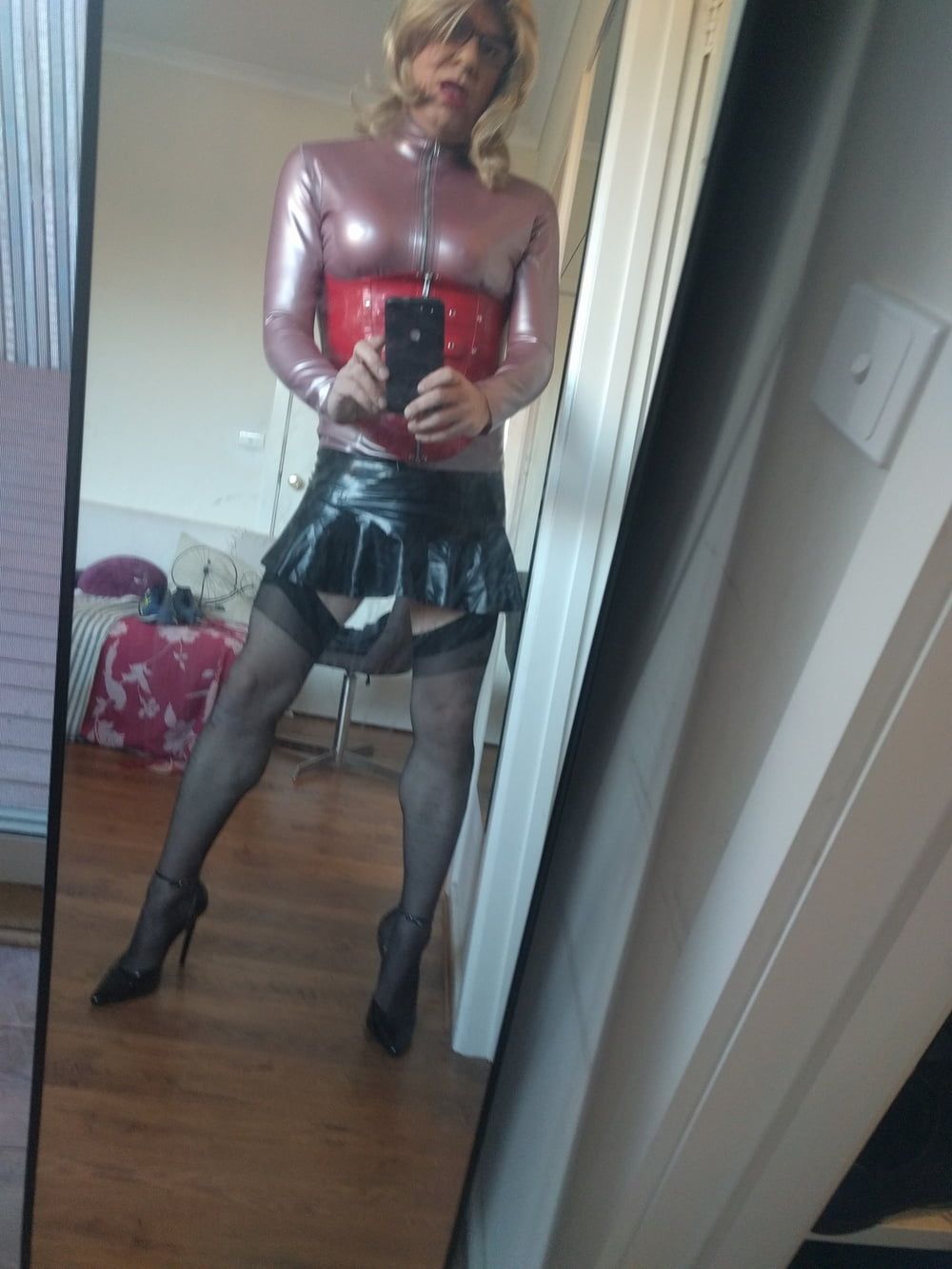 Back as a short blonde latex girl #6