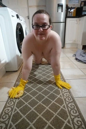 naked cleaning in rubber gloves         