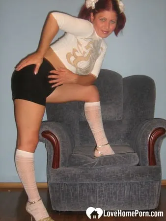 flexible teen in knee socks uses a toy         