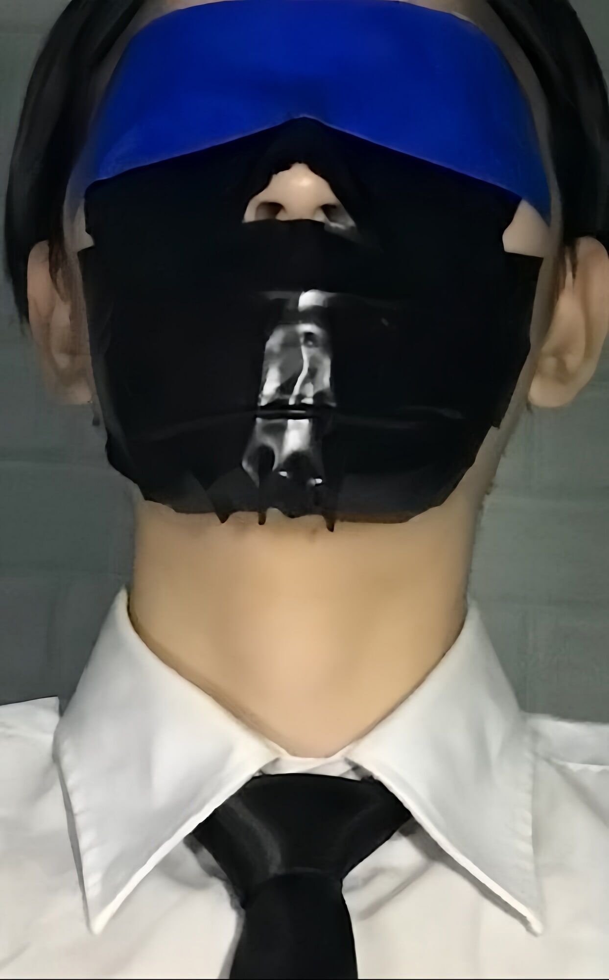 Wearing a white shirt and shiny black tie, gagged with duct  #25