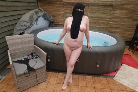 wife showing off big breasts and ass in niqab         