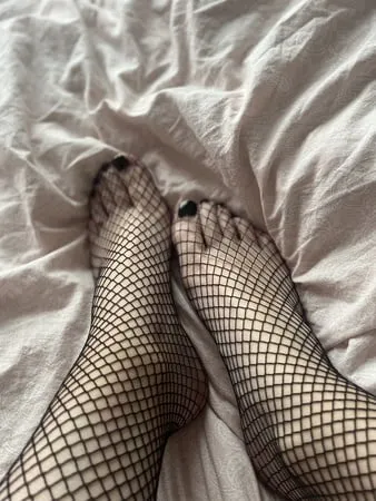 foot with fishnet socks         