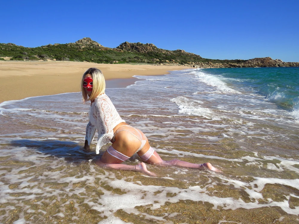 Sexy MILF Blonde shows off her ass on the beach. #6