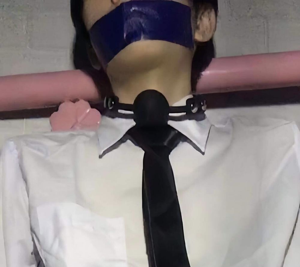 Wearing a white shirt and shiny black tie, gagged with duct  #14