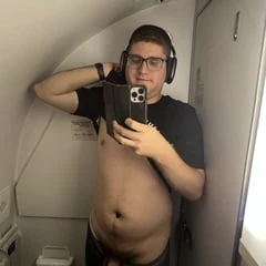 Naked in a airplane toilet