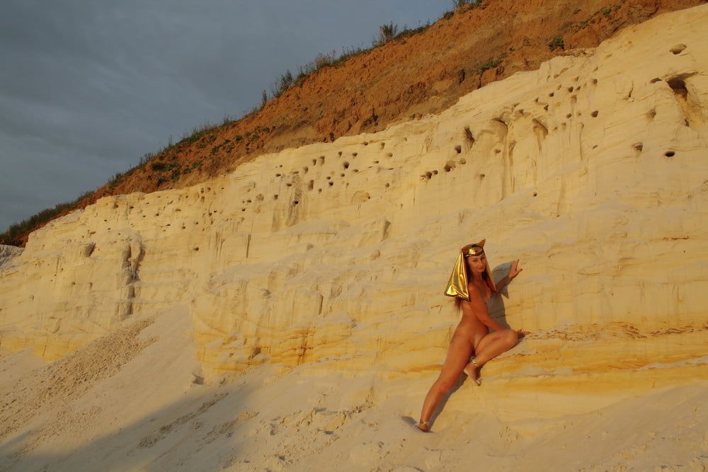 Posing Naked on White Sand in Sunset Time