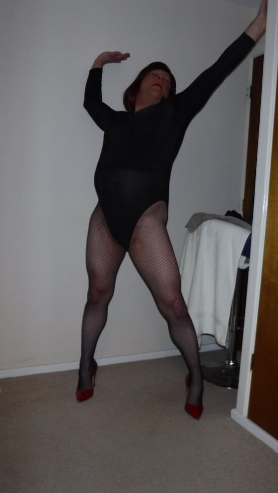 SISSY ROSIE IN FISHNET, RED HEELS AND BODYSUIT #11