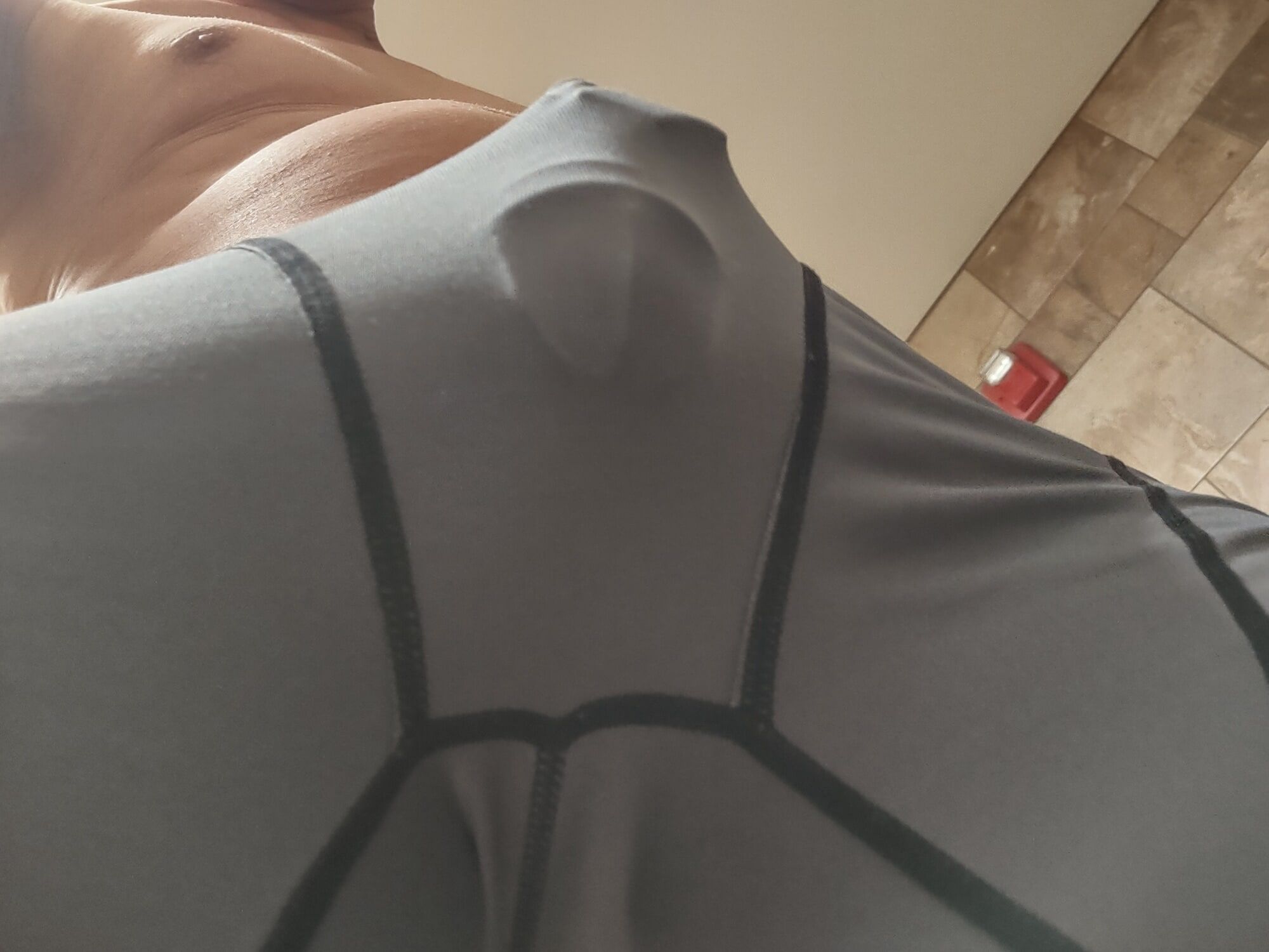 Wearing my cock cage in my spandex compression underwear 