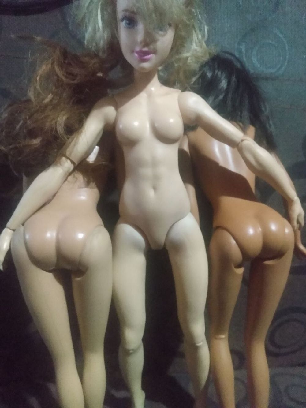 Muscular doll and her girls