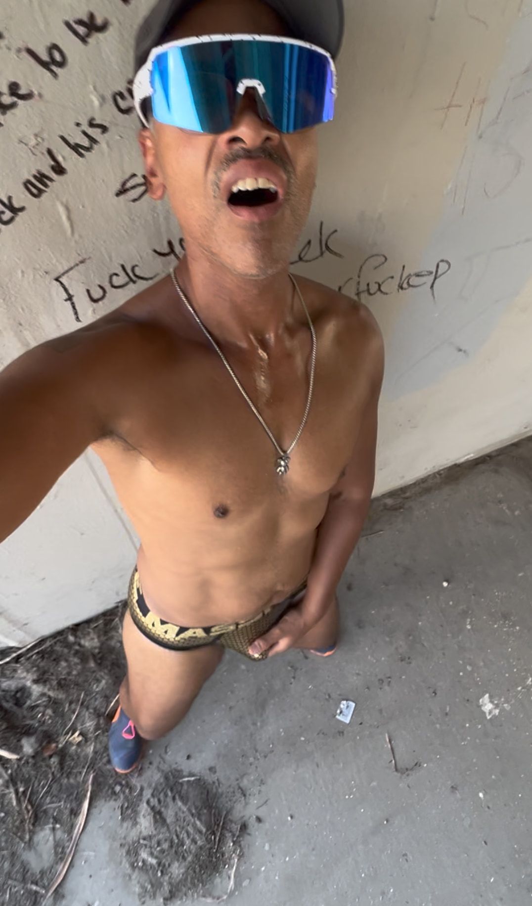 WHORE SLUT SHOWING BIG GOLD BULGE UNDER BRIDGE