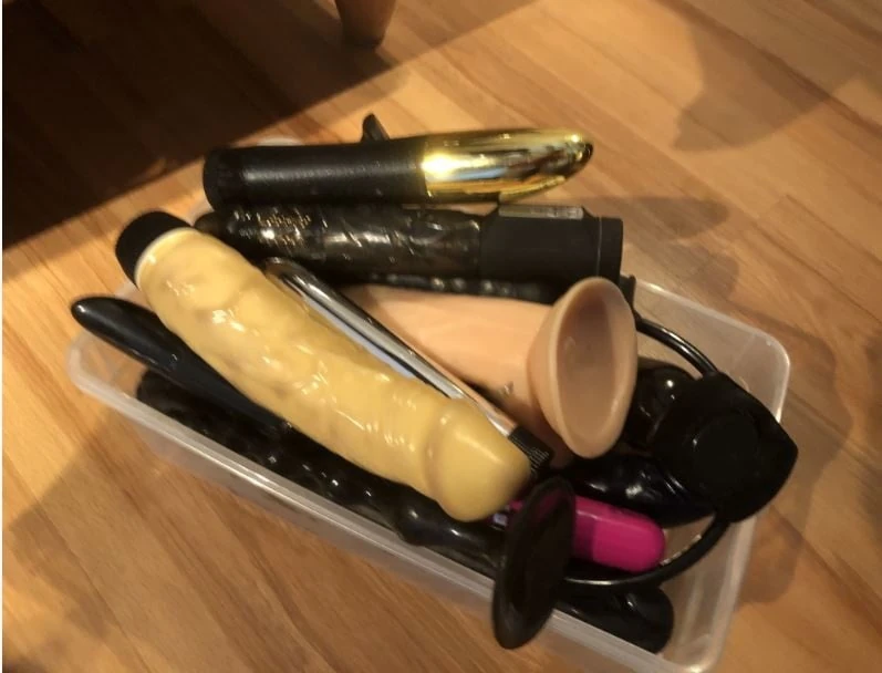Latex and Dildos on Bed 