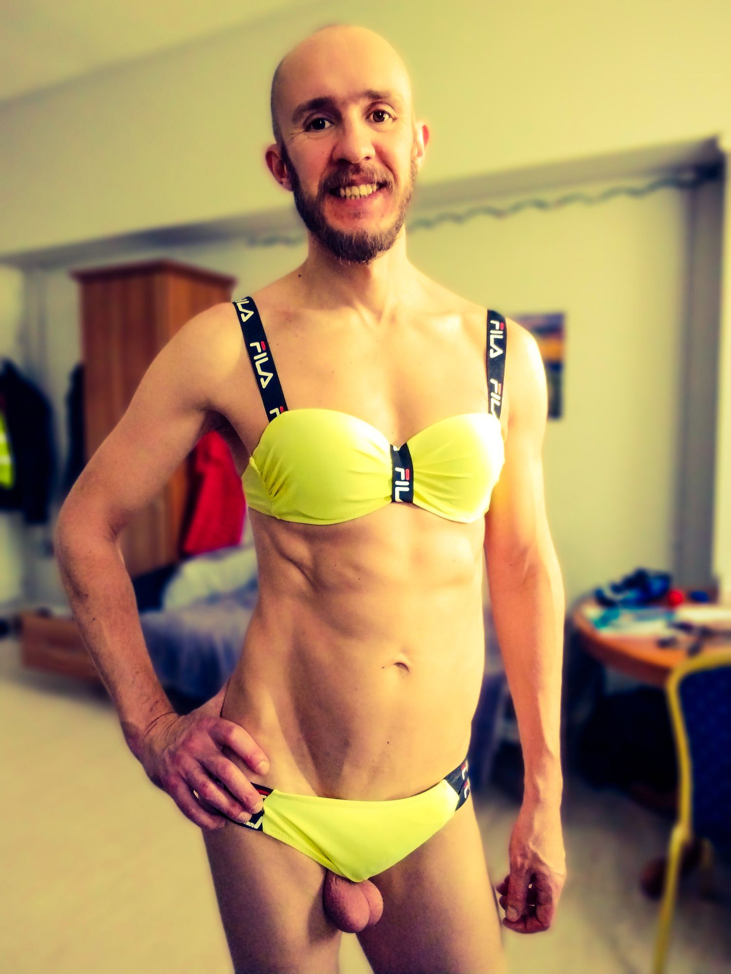 Bearded athletic man posing in yellow swimsuit  #10