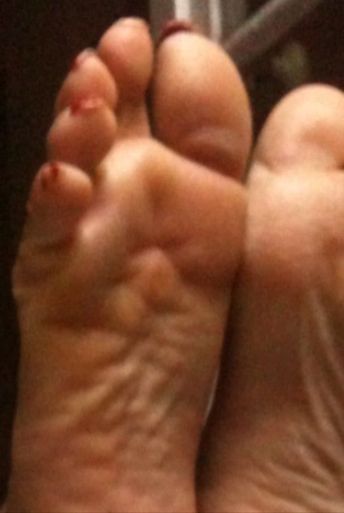 used red toenails, and soles feet after day at beach #8