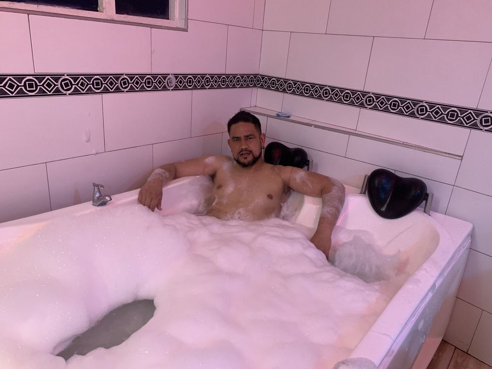 Resting in the bathtub, taking a foamy bath