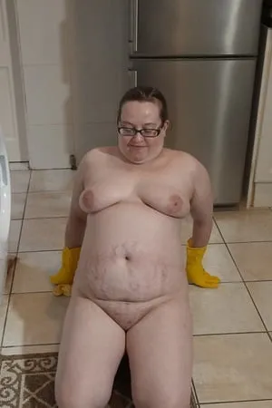 naked cleaning in rubber gloves         