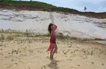 red shawl on white sand         