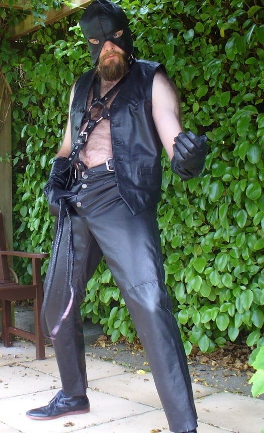 Leather Master outdoors in harness with whip #15
