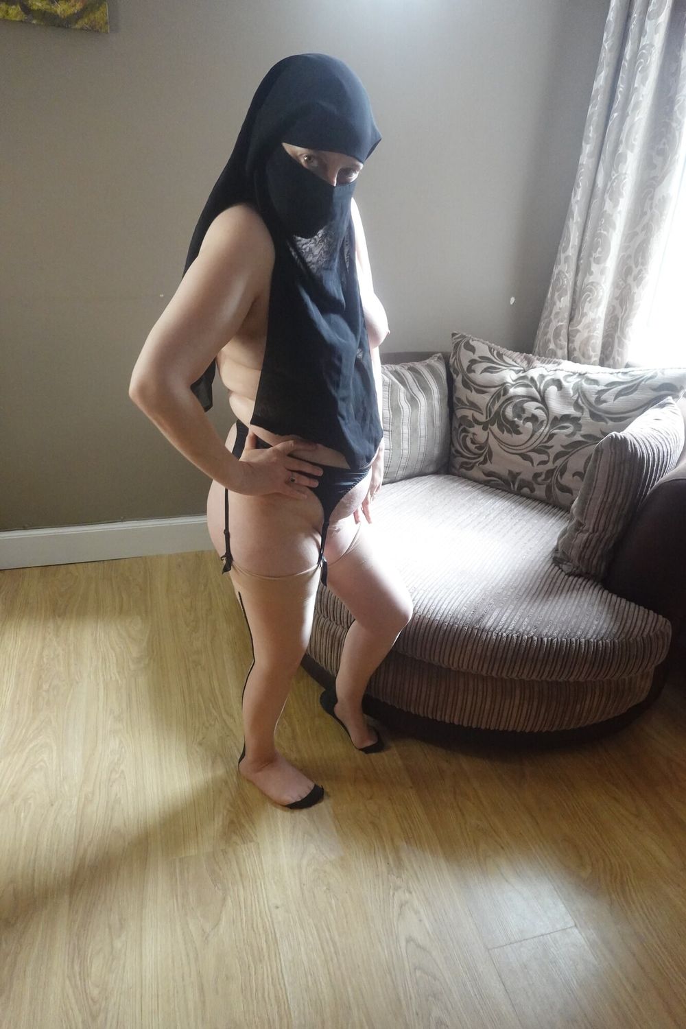 Wife Posing in Niqab stockings and suspenders