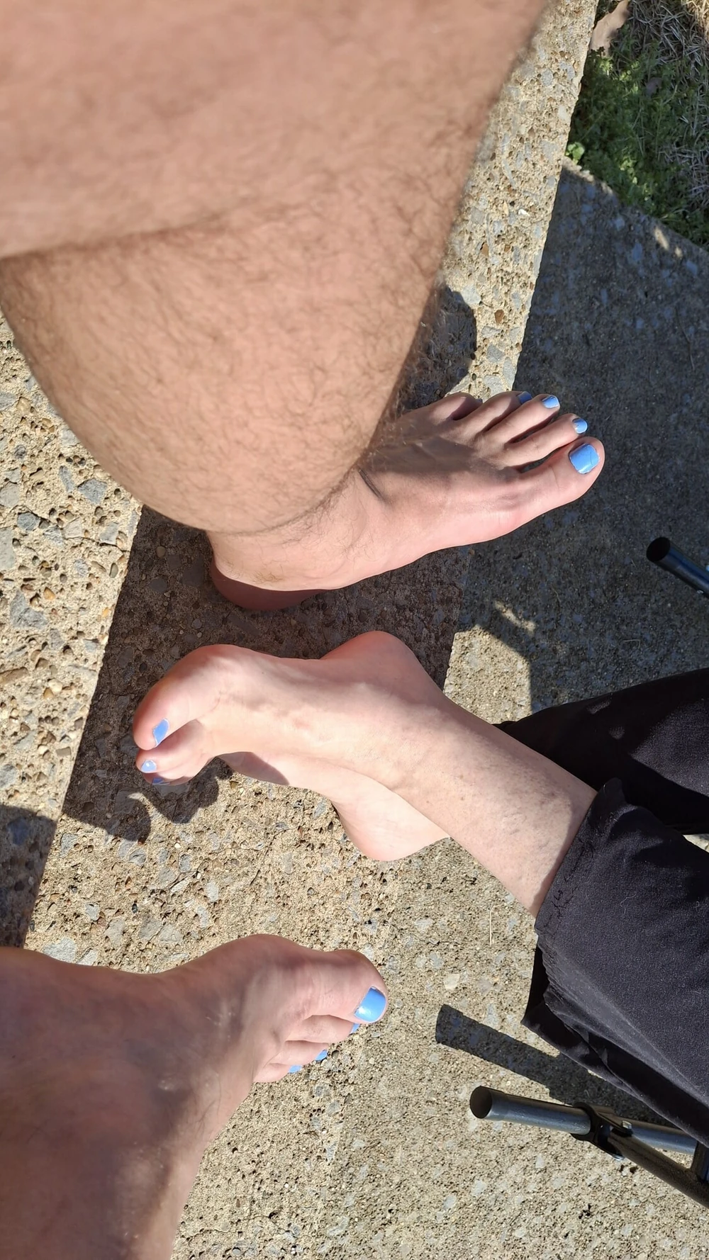 Relaxing outside showing our pedicured and painted toes #13