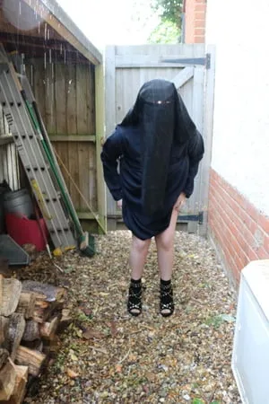 burqa outdoors flashing in the rain         