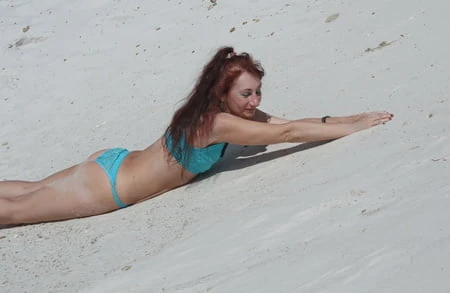 on white sand in turquos bikini         