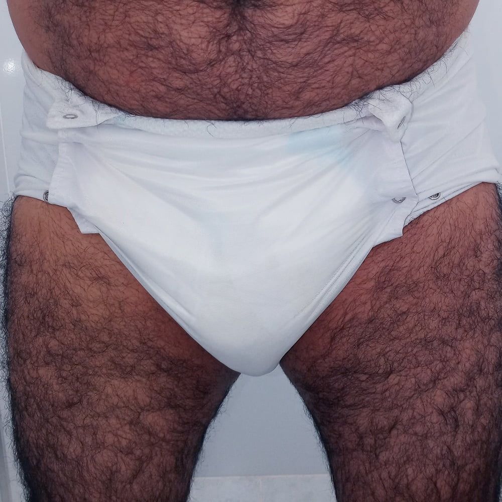 SHOWING WHITE DIAPER IN WORK BATHROOM. #10