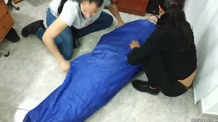 sexy girl trapped in ultra tight layered mummification         