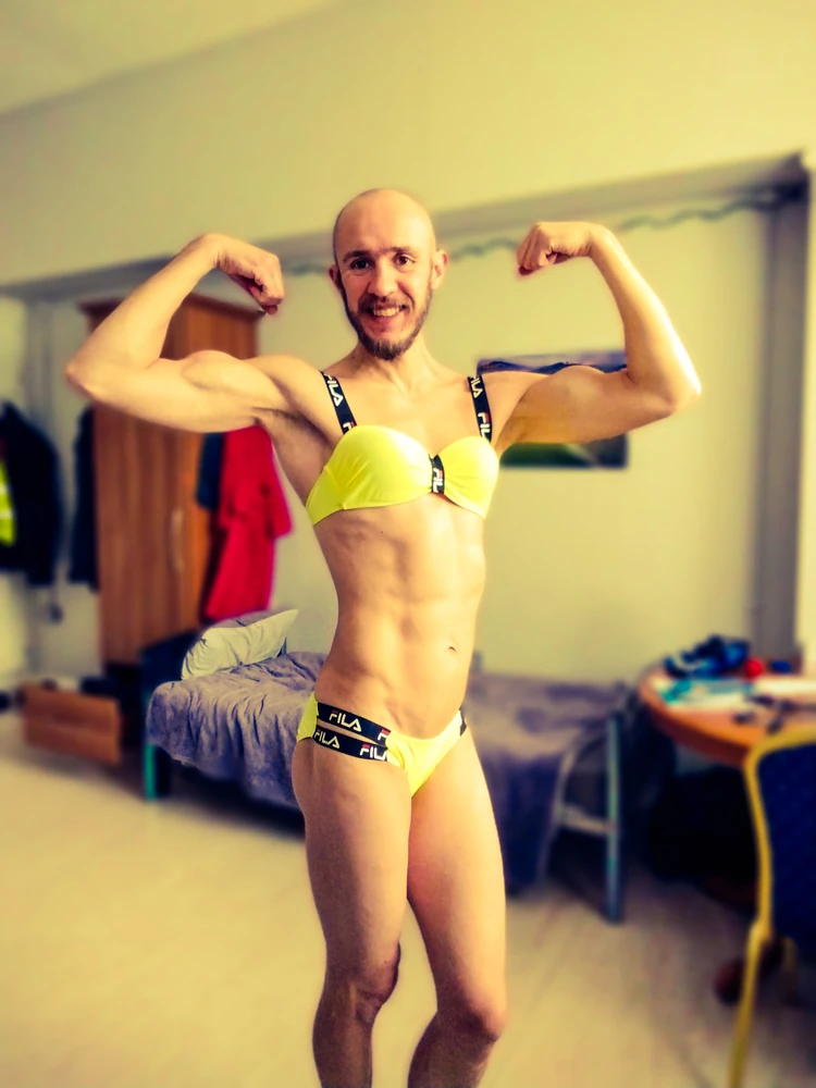 Bearded athletic man posing in yellow swimsuit  #3