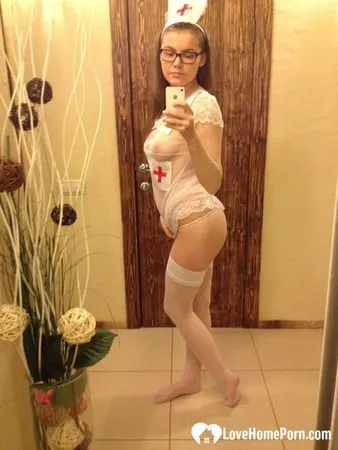 smoking brunette pulls off the best nurse costume         