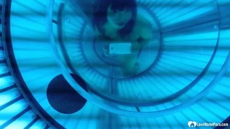 asian sweetie taking selfies while tanning her body         