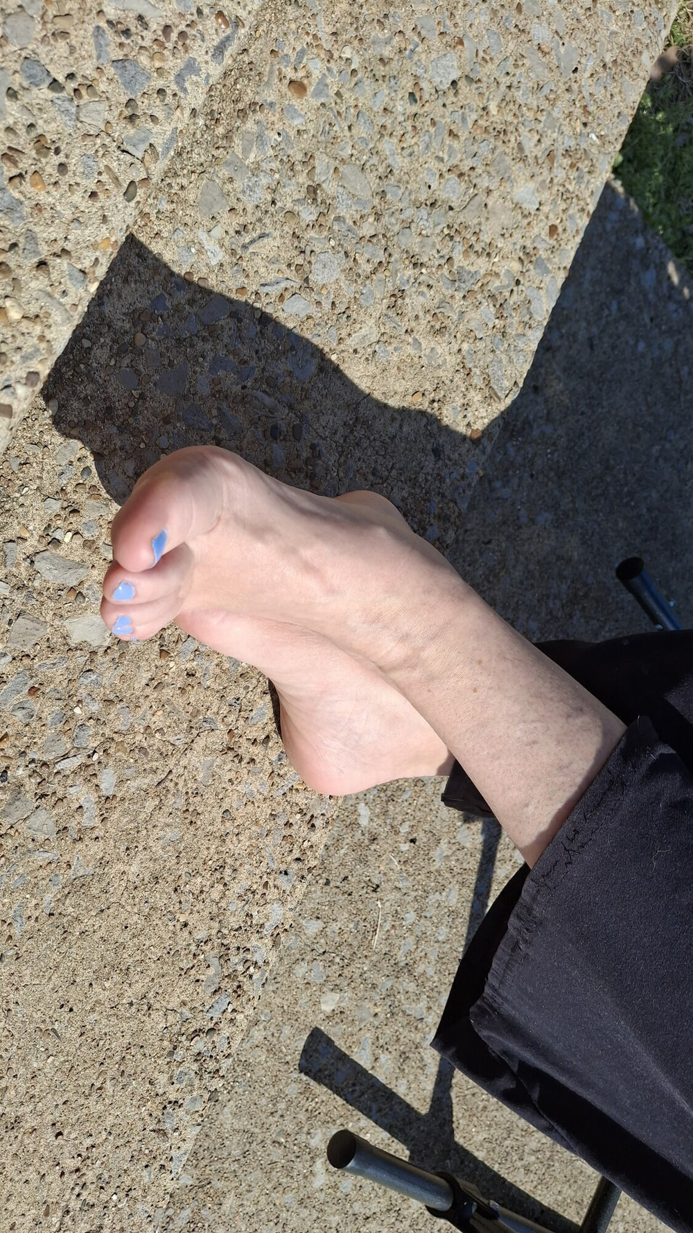 Relaxing outside showing our pedicured and painted toes #11