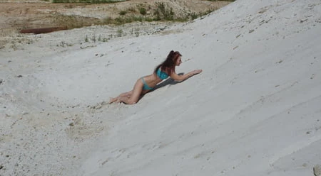 on white sand in turquos bikini         