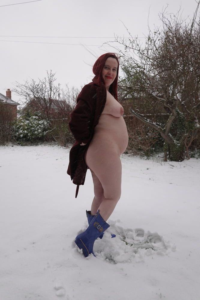 Pregnant flashing naked in the cold snow