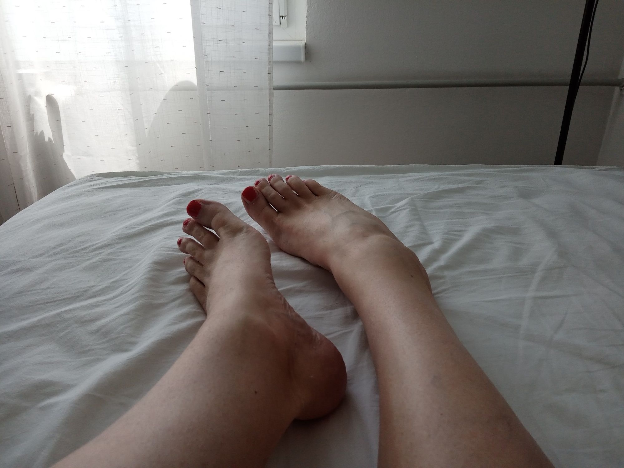 MILF tranny shows off her feet with red painted toes #2