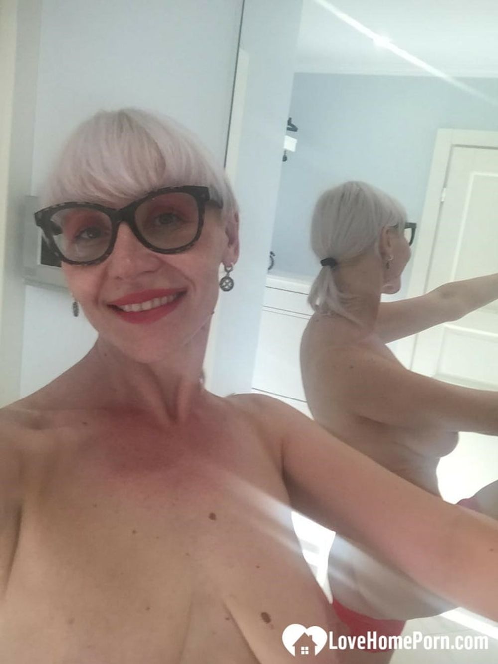 Blonde MILF with glasses teasing with nudes #28