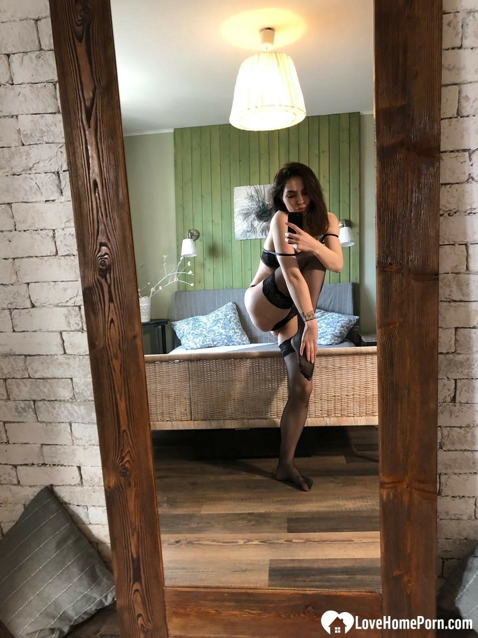 Brunette in black stockings posing for a mirror #14