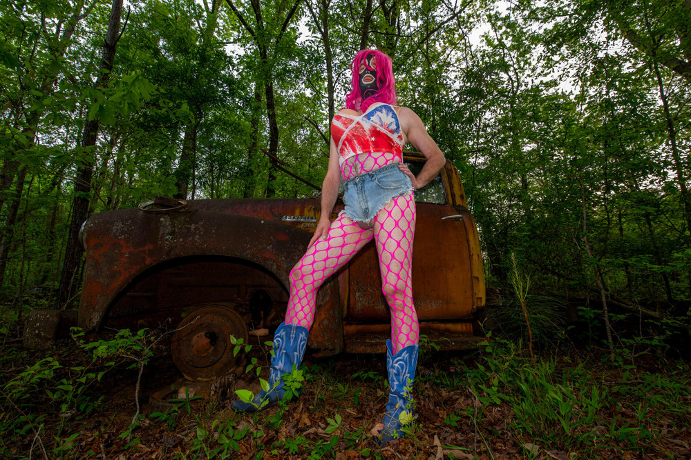 Giant fake tits crossdresser in Daisy Dukes and halter