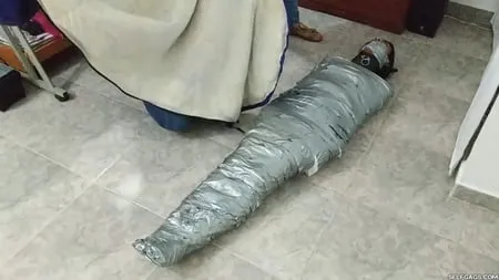 heavily duct tape mummified by crazy bondage women         