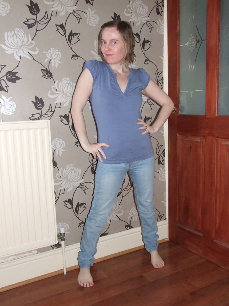 cute blonde posing in jeans and shirt 