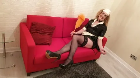 latex maid with a pump up anal plug stockings and heels         