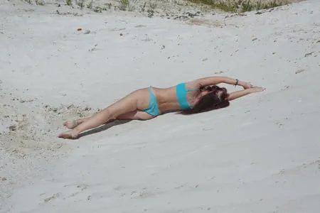 on white sand in turquos bikini         