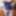 Sissy Aleksa posing in blue corset and green stockings