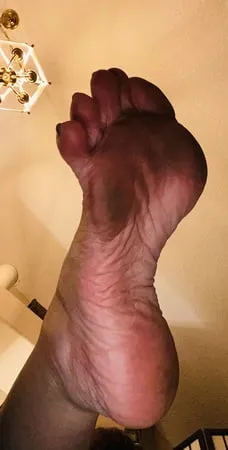 closeups dirty clean soles and toes         