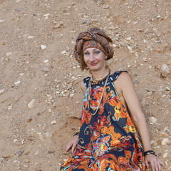 With spear wearing in colorful dress